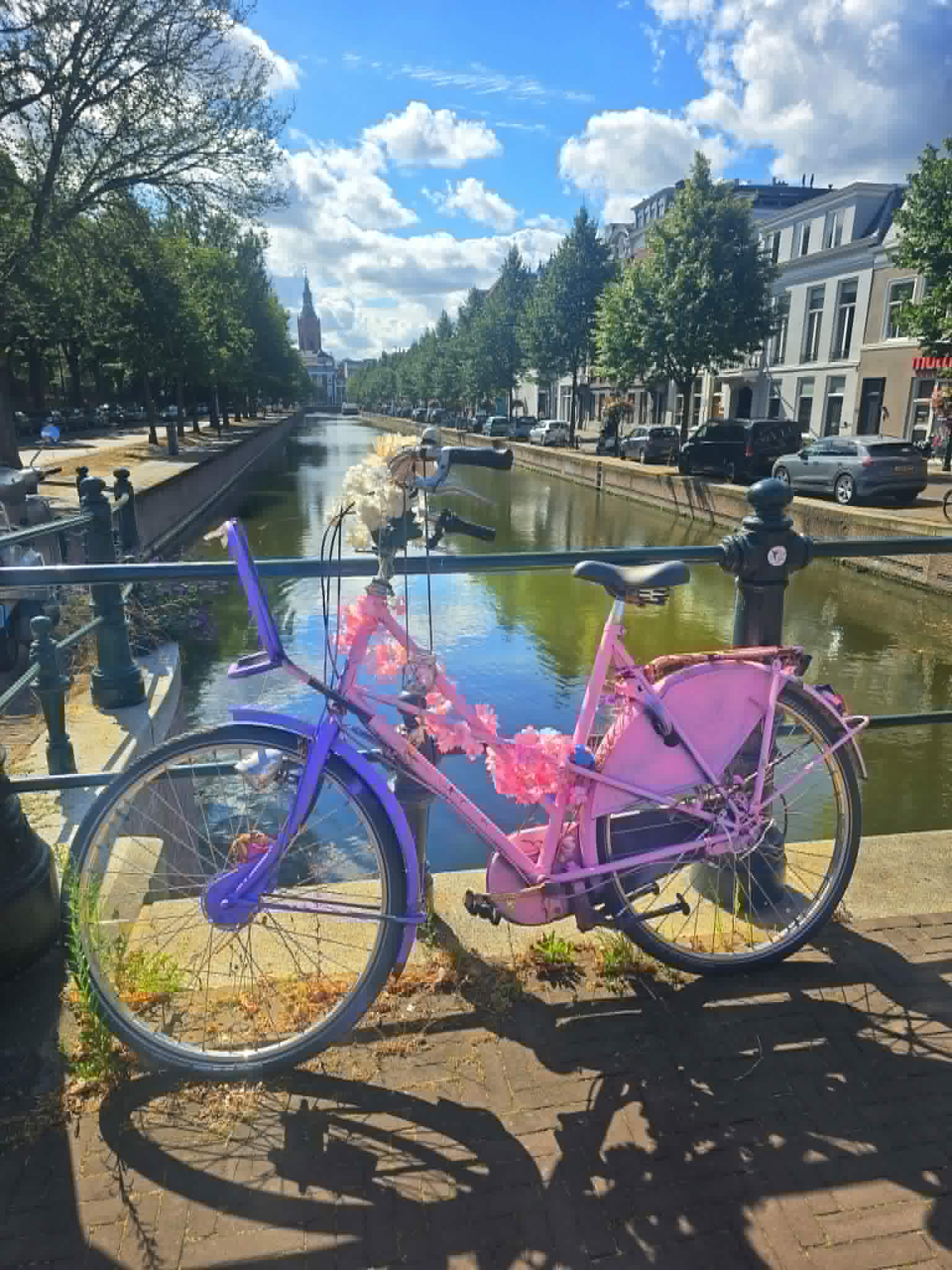 A bicycle leaning against a wall, a simple joy on the road