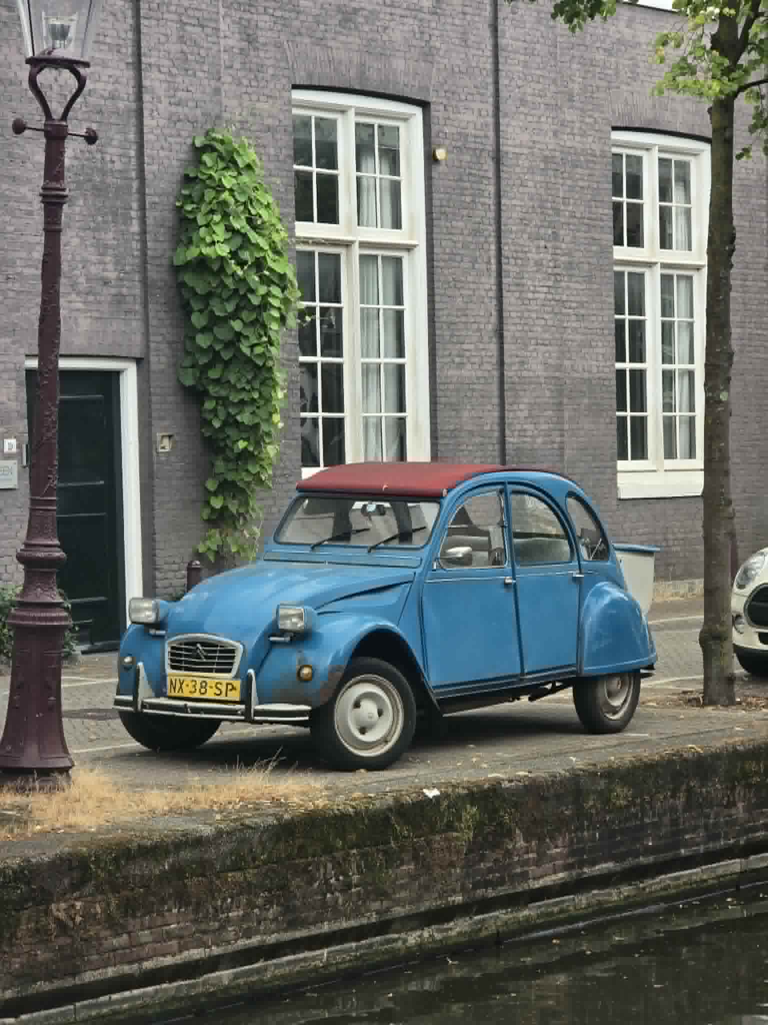 A car parked along a road, somewhere between departure and arrival